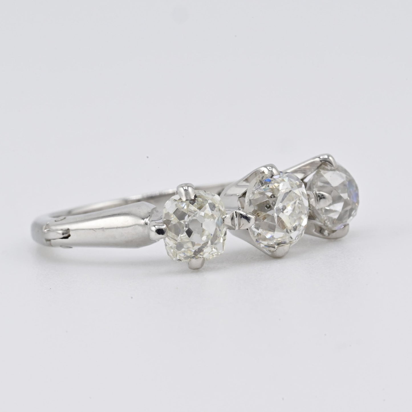 Edwardian 18K White Gold 3-Stone Diamond Ring 1.87 Carats Old Mine Cuts