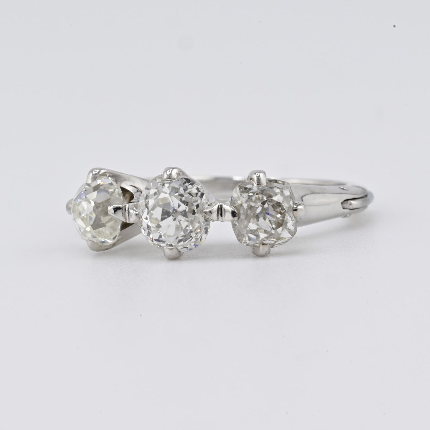 Edwardian 18K White Gold 3-Stone Diamond Ring 1.87 Carats Old Mine Cuts