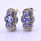 IGI Certified 1.78ctw Tanzanite & Diamond Scalloped Halo Earrings in 10k Gold