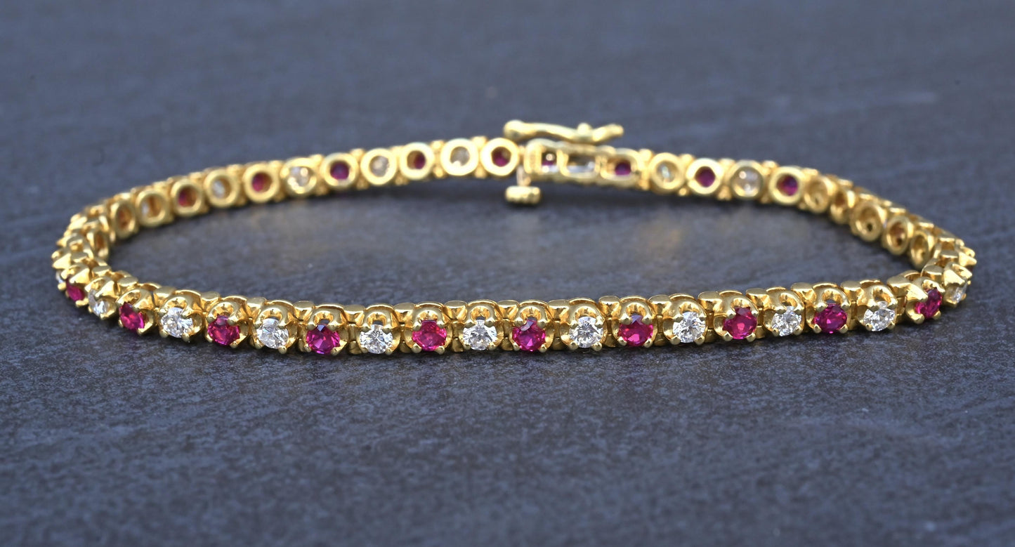 3.05 TCW Ruby & Diamond Tennis Bracelet in 18K Yellow Gold – 7" – IGI Certified