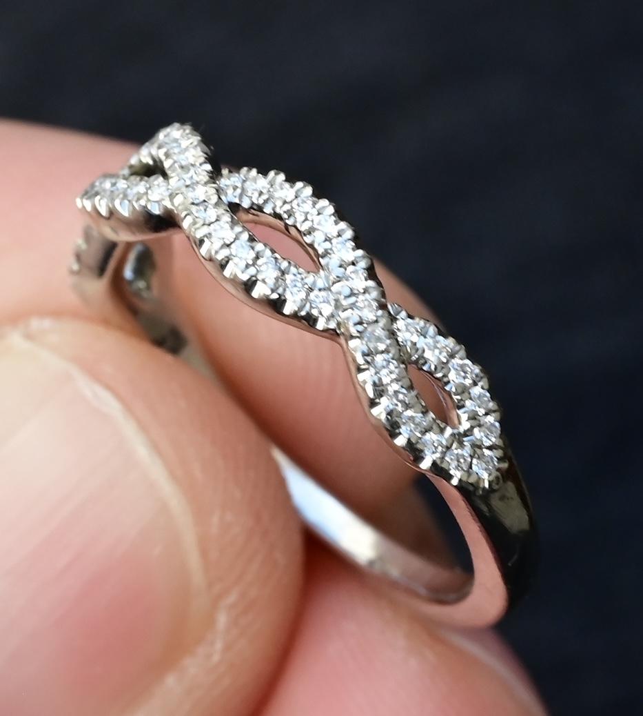 Platinum Diamond Infinity Twist Band – 0.12–0.15ct Total, Size 6.5