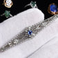 Art Deco Brooch in 14K White Gold with Blue Sapphire & Diamonds IGI Certified