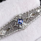 Art Deco Brooch in 14K White Gold with Blue Sapphire & Diamonds IGI Certified