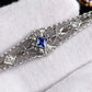 Art Deco Brooch in 14K White Gold with Blue Sapphire & Diamonds IGI Certified