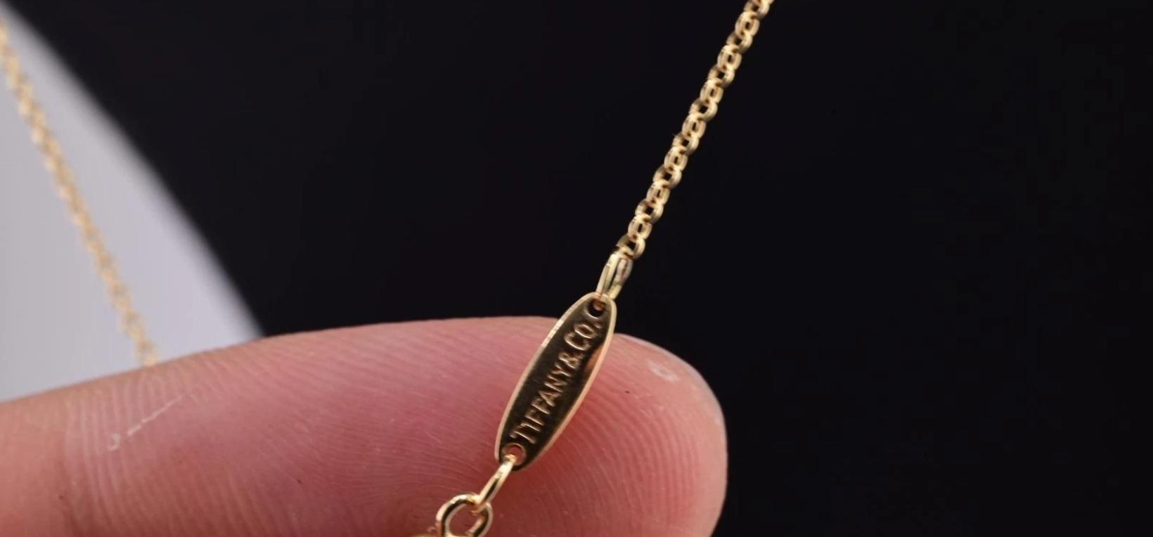 Fantastic Elsa Peretti Tiffany & Co. Yellow Gold Cursive L Pendant